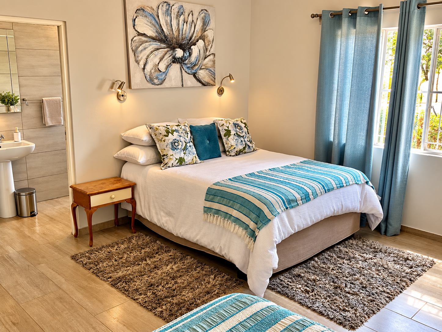 A comfortable farmhouse bedroom at Soetblomspan with soft light and en-suite access